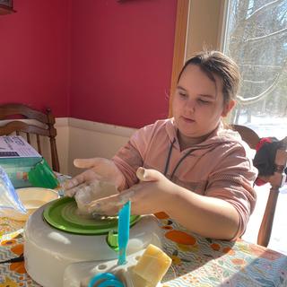 Mia making a bowl
