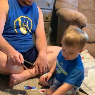 Dad and son playing together