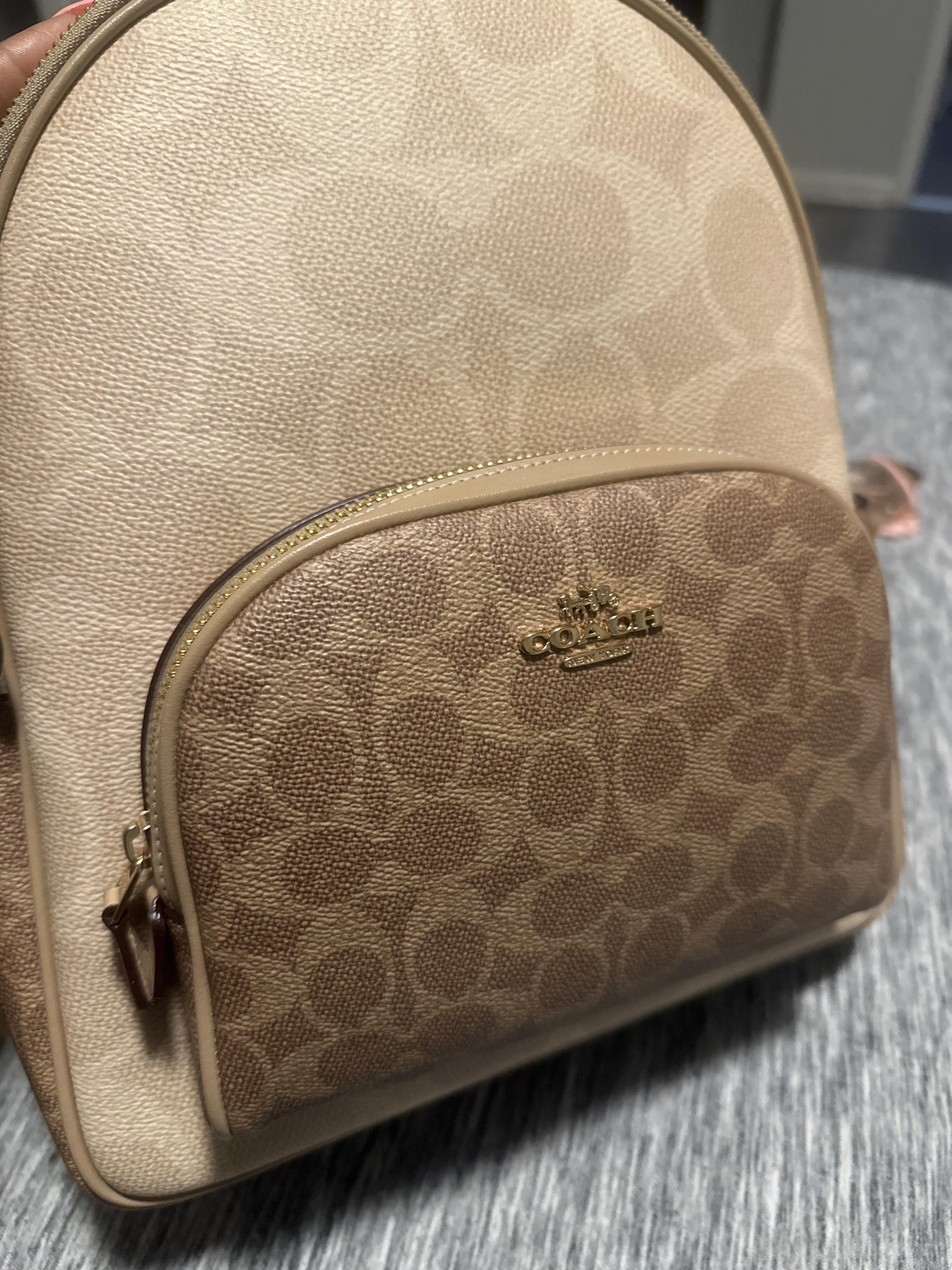 coach backpack magnetic snap tan COACH Signature Canvas Warner Backpack CW211 QBNRX Signature jacquard refined pebble leather and smooth calf leather Inside zip cell phone and multifunction pockets Inside tech sleeve Drawstring and snap closures fabric lining Top handle with 3 1/4 drop Outside zip and flap pockets Adjustable shoulder straps Luggage sleeve 11 1/4 (L) x 17 3/4 (H) x 6 1/2 (W) Style No. Court Backpack In Blocked Signature