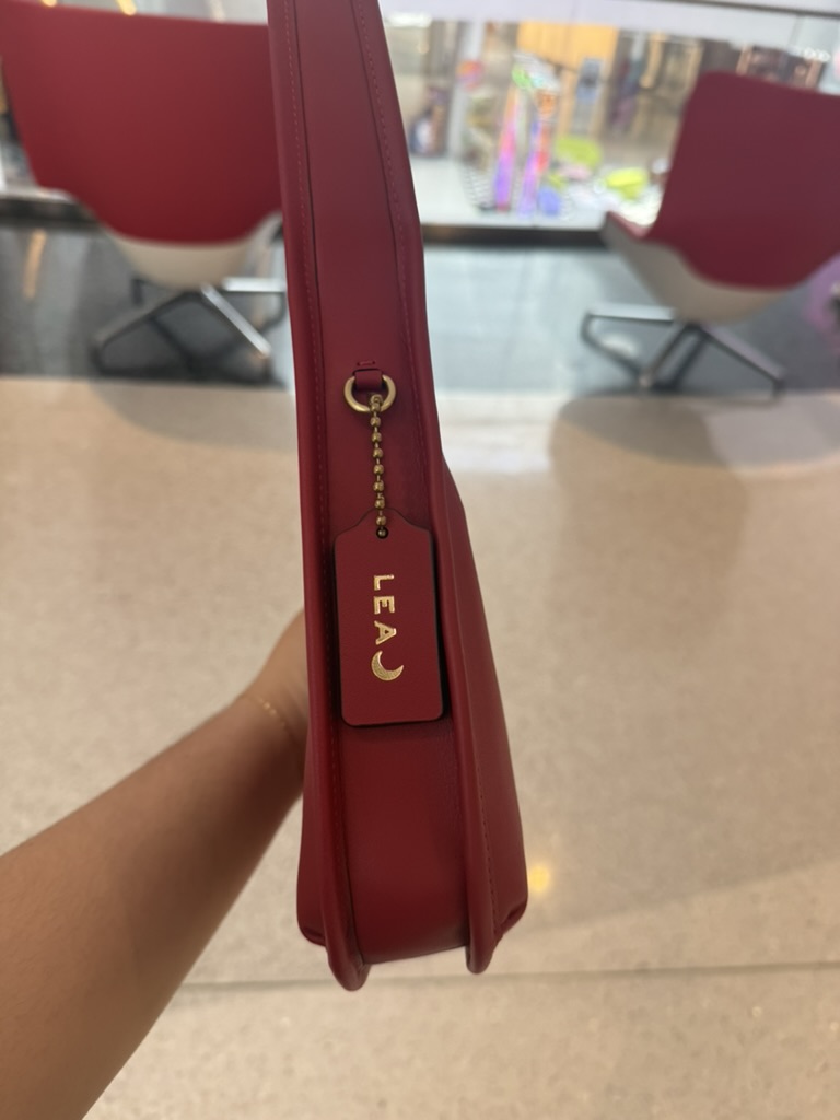 COACH® | Curve Zip Bag
