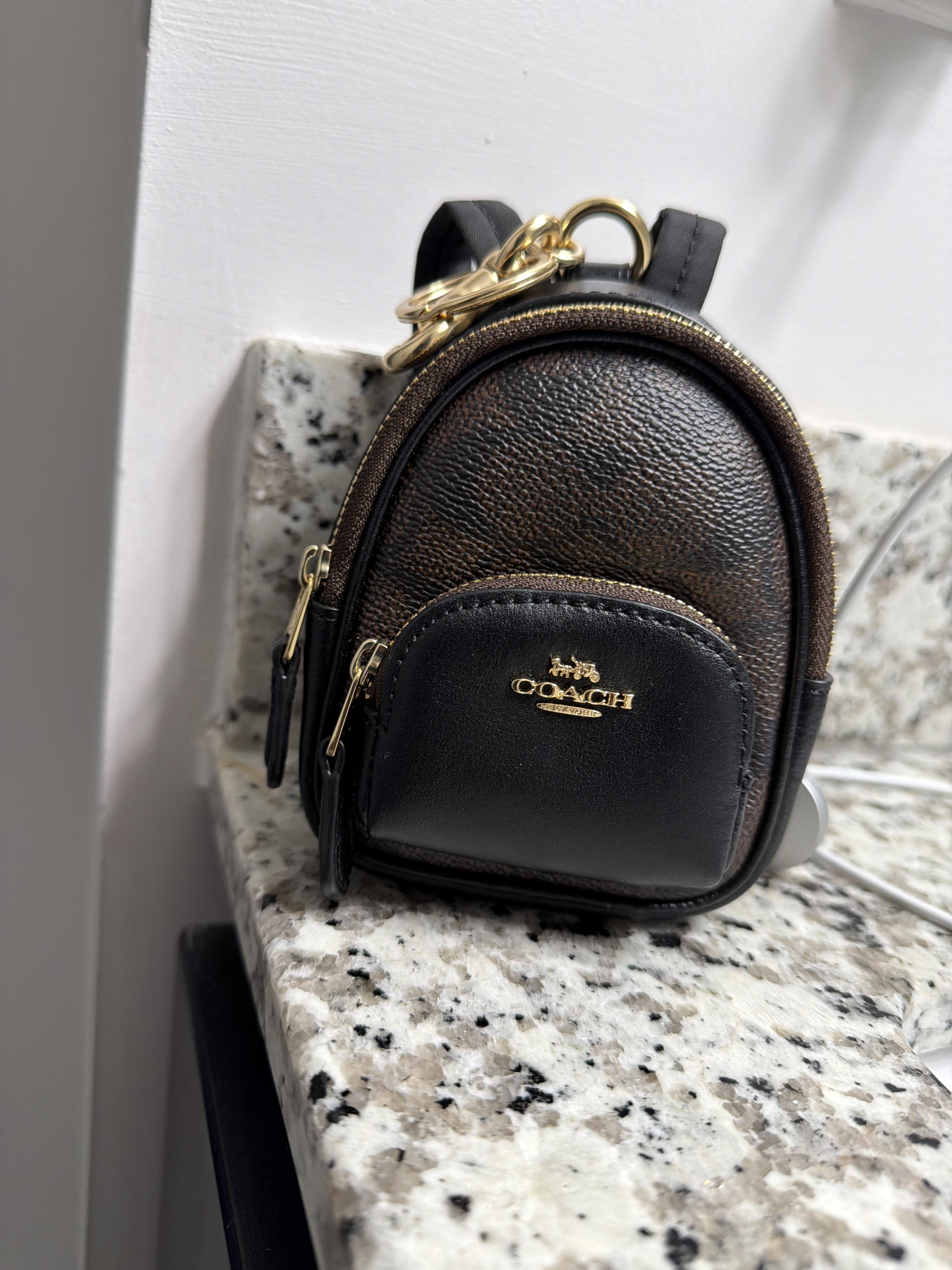 coach backpack coin case bag charm Buy Mini Court In Signature Canvas in Tan/ Brown CX066 Online in Singapore Signature coated canvas and smooth calf leather Drawstring and magnetic snap closures fabric lining Outside flap pockets with tab closures Adjustable straps Attached dogleash clip 3 (L) x 4 1/2 (H) x 1 1/2 (W) Style No. Designer Coach Mini Backpack Bag,