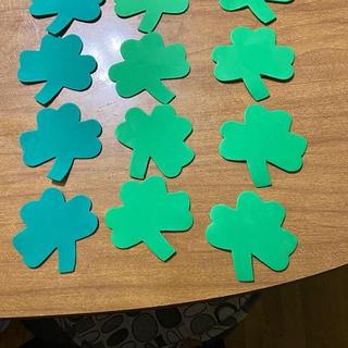 The shamrocks are 4 of one green and 8 of another.