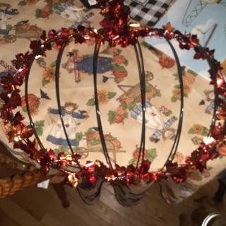 Wire pumpkin with garland.