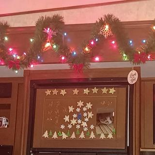 Ornaments hanging between garland