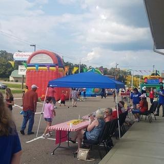 Banner across our parking lot at outdoor carnival