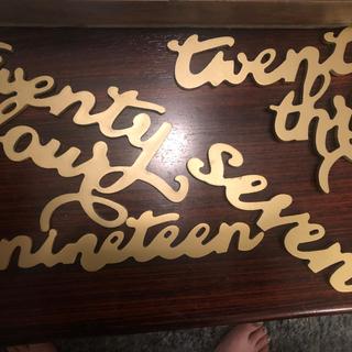 improperly laser cut letters of varying sizes and quality