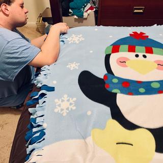 Working on the penguin blanket.