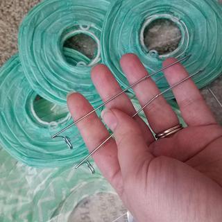 color off, patch visible by index fingernail, bent supports, and one support missing