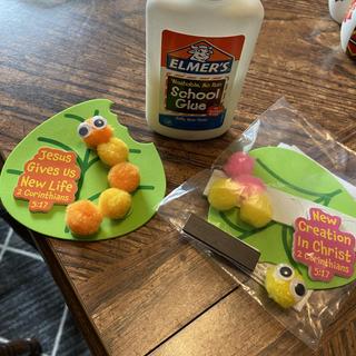 Pre glue eyes to a Pom pom