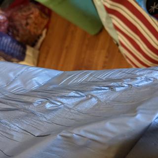Gathers and wrinkles down the center of the table that wasn't able to come out