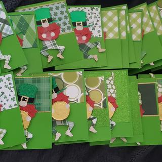 Leprechauns holding coins