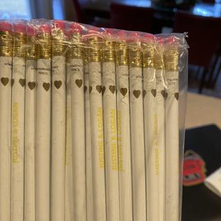 Yellow print on white pencils.