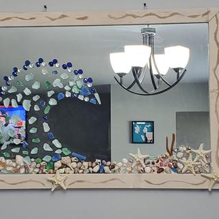 Sprinkled sand on the frame of this seaglass mirror, it made the perfect accent for my project.