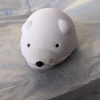Black mark near the nose, and untrimmed seam on side of the face