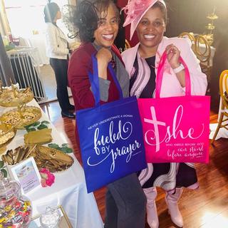Ladies posing with gift bags