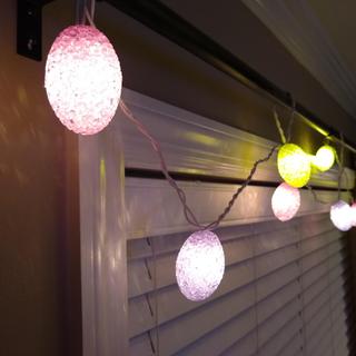 Egg light strand on window curtain rod