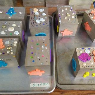 Kids decorated these boxes to use to collect treasures.