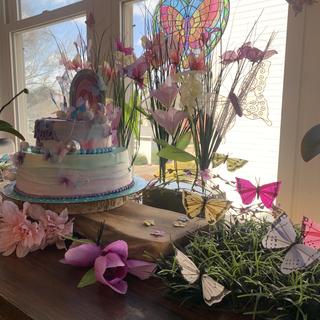 Butterflies around the cake