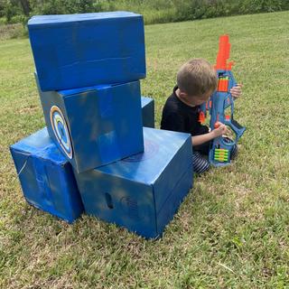 Gearing up for a Nerf game with targets in place every couple of yards