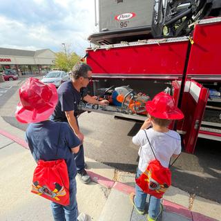 Firefighters demonstration on 9-11 with firefighters gift bags