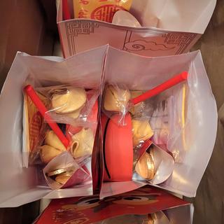 Made pkg favors with drum and fortune cookie in the paper bag