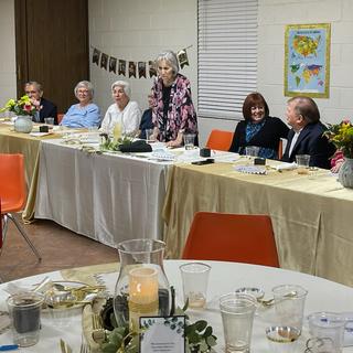 Head table had opened fans for each lady.
