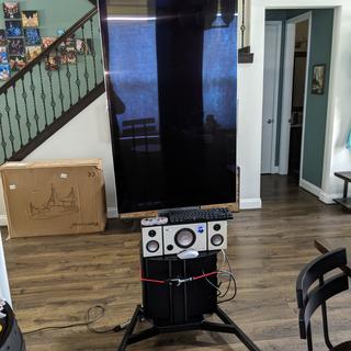 front view with 2017 55 inch samsung qled off.. the old speakers were a bit heavy fro the shelf.