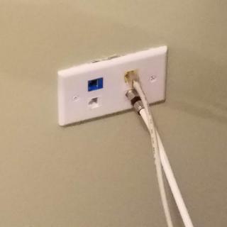 Finished wall plate with blue cat5e, white cat5e, yellow cat6, and coax.  All from Monoprice.