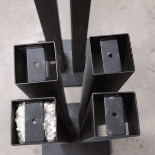 Fill legs with sand leaving 2-3 inches from top. Fill with more spray foam sealing in sand