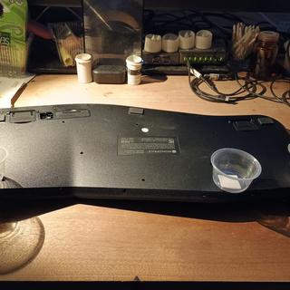 Position of plastic cups on base of keyboard.