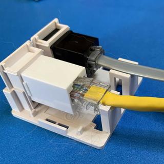 Near outlet modified to accept keystone connector with patch cable