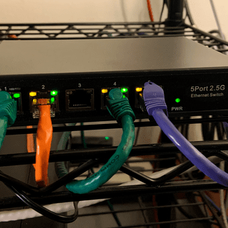The Monoprice Cat6 3ft Orange Patch Cable in repose
