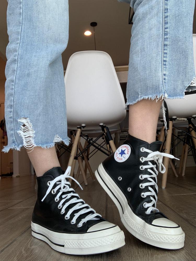 I received these Chuck 70 LEATHER Hi BlacK Converse shoes about a month ago and I have been wearing them ever since! They are my new favorite pair of shoes. They are made of high quality leather, the stitching and quality of the shoes are amazing, and they look good with almost every outfit. I know converse can sometimes run half a size large but these were true to size. The only con I have is that these shoes can be tricky to put on, as the back folds over as you put your foot in but if you loosen up the laces then it’s much easier. I wear these almost everyday and they have held up well with almost no signs of wear after several weeks of consistent use. 10/10!
