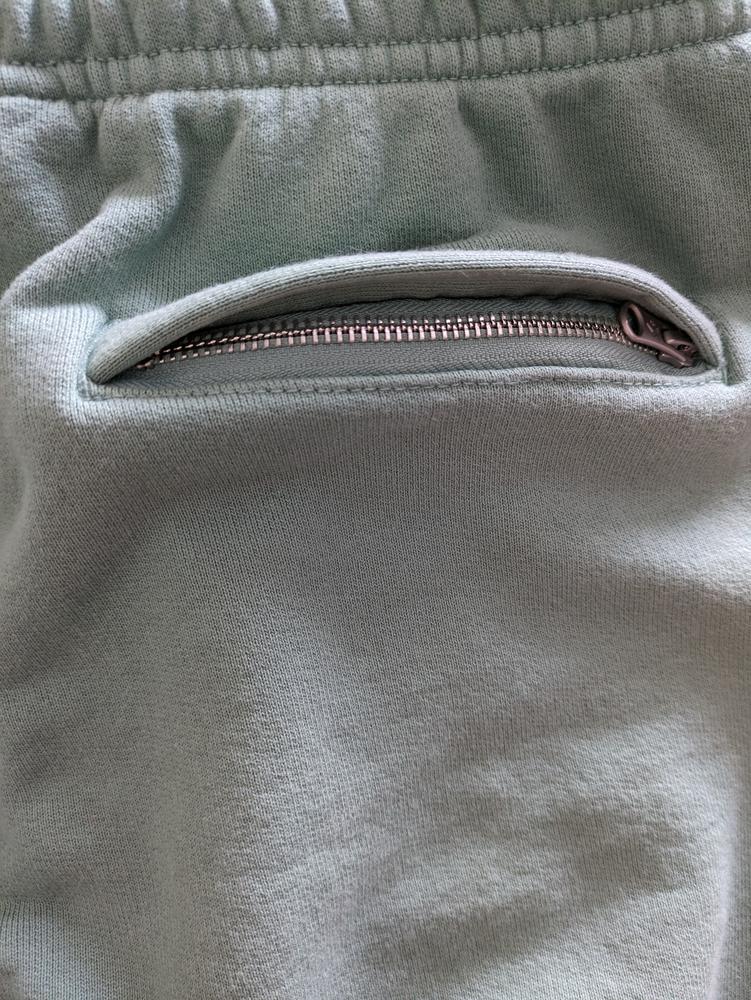 These are the perfect sweatpants to keep you warm. They are thick and have a baggy loose fit. I like the full size back zippered pocket to keep your valuables safe. These sweatpants feel really comfortable and the inside is soft. They are made well as I have washed them and there is no pilling. The size is a true fit.
