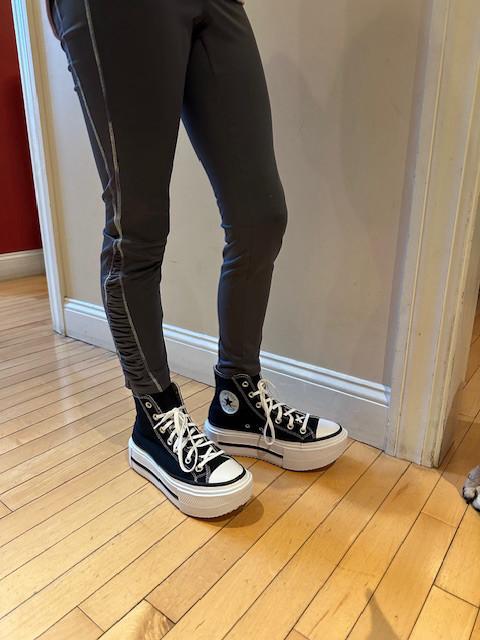 These Chuck Taylor All Star Lift Double Stack Shoes pair the classic look of the Chucks we all know & love with a trendy platform sole. Definitely a new take on their classic style & I love it! They add about 2” to my height, & the toe has a slight lift that allows your foot to naturally roll heel to toe when you walk. They are incredibly cushiony – almost bouncy!! - & comfortable, even on days when I’m on my feet all day. They do run a bit big, so I sized down a half size and they’re perfect. The style is super versatile & can be paired with almost anything - skirts, jeans & joggers, a sundress or shorts. The ultra-high platform adds a trendy edge – they’re cool & not clunky. And although these shoes appear to be big – they’re not at all heavy. They’re made from the same materials you’ve come to expect from Converse, so they’re soft, comfortable, durable with materials that are made to last. And of course they have all of the same iconic Chucks details. LOVE these!!