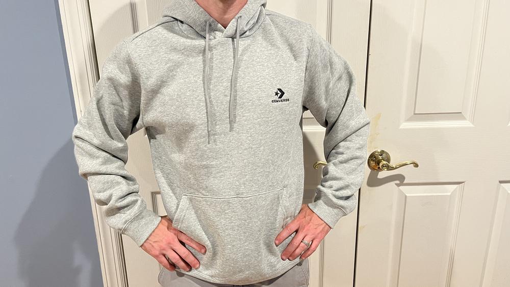 If I could design the perfect hoodie, this Converse one would be it! The first thing you notice is how soft and comfortable it is - it doesn't stick to your skin and feel itchy, and it's also not too baggy. I ordered a Small and the fit is just right. I wear this hoodie around the house, running errands, and even for shooting basketball in my driveway with my kids. Overall, the feel and versatility of it has quickly made this hoodie a favorite of mine. 5 stars all around!
