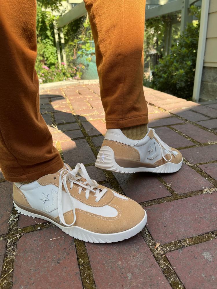 I appreciate that the shoe has a comfortable toe box without appearing bulky or clownish. The ability to cinch the laces accommodates a slightly narrower foot well and the honey gold tone suede fabric and soft white canvas color are exactly as modeled online. The way the sole wraps the back of the heel with the Converse star embossed is a fun style statement. I love the comfort for a long day of walking and the hip yet classic style works well with sweats, jeans or wide legged linen. Adding more footbed cushion and a bit of arch support would be a plus.