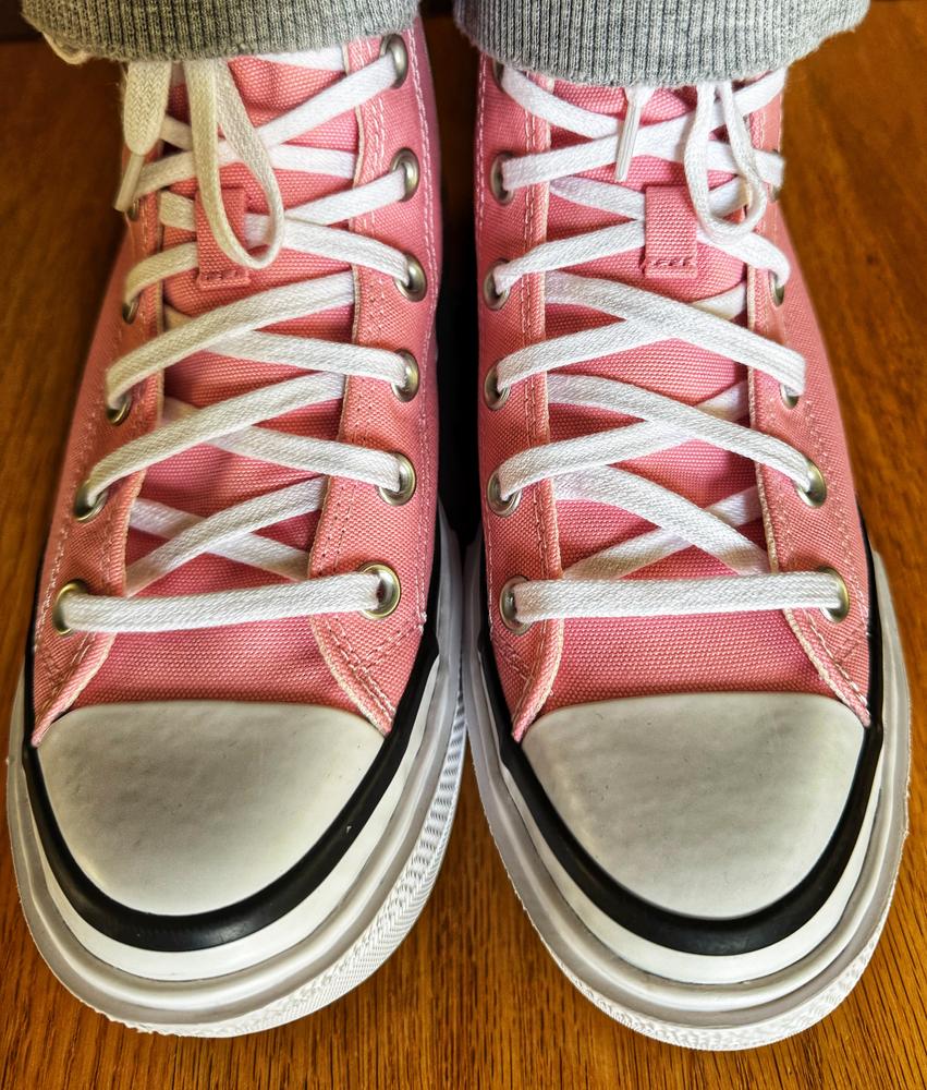 My wife who always complains about our 10 inches height difference is so ecstatic with her Chuck Taylor All Star Lift Double Stack Shoes as this minimizes the difference. She is not a fan of high heeled footwear and loves athletic shoes and this brings the benefit of both and thus she loves this pair. The shoe is raised by the same height throughout with a slight curve near the toes. She feels this provides better support while walking as this keeps her foot at the same level all along and provides even weight distribution on her feet. My wife normally prefers tan, brown or black shoes but she absolutely thrilled with the pink color of the shoes. Shoe is made of a breathable fabric and the inside fabric feels both soft and smooth.This shoe runs a little larger. She uses size 7 but a 6.5 would also be comfortable. These are wonderful shoes to own for to own for everyday use. We would recommend these shoes for its comfortable feel and lovely array of color, making it a unique pair.