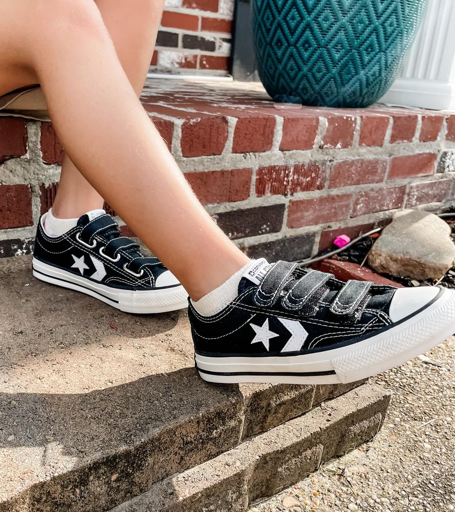 The Star Player 76 3V, is a great kids shoe. The black and white and simple sleek design is so versatile. My daughter has worn these running around, skate boarding, riding her bike and simply being a kid and it was withstood so much ware and tear and you wouldn’t even know. We have gotten so many compliments on every time we go out. The canvas are so easily to clean, we normally just spot clean with a wipe that we have in the car or diaper bag. No longer are the days were you have to fight to tie shoes, the three rows of velcro make it easy for kids to put on and customize how tight they want their shoes. These are a classic shoe that you will want to hand down for generations to come!
