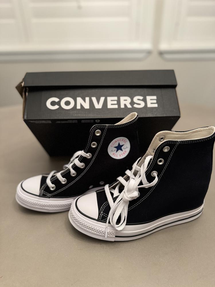 I recently tried the Chuck Taylor All Star Wedge shoes, and overall I find them to be a fun twist on the classic Converse style. The wedge design is a fresh take, giving you extra height while still keeping the iconic Converse look. I love the signature black canvas and the white rubber detailing; it’s both stylish and casual.

Size wise, I am usually between an 8.5 and a 9 depending on brand. Size 8.5 is what ended up working for me. The wedge can take a little getting used to but it offers a nice balance between style and comfort. The fabric is the same classic canvas that Converse is known for.

I love that these shoes give you extra height while still maintaining that laid-back vibe. One thing to note, I have skinny (chicken!) legs/ ankles and the opening at the top of the sneaker is just right. I could see them being a little snug on someone with a wider lower leg. Overall they are a great pair of shoes.