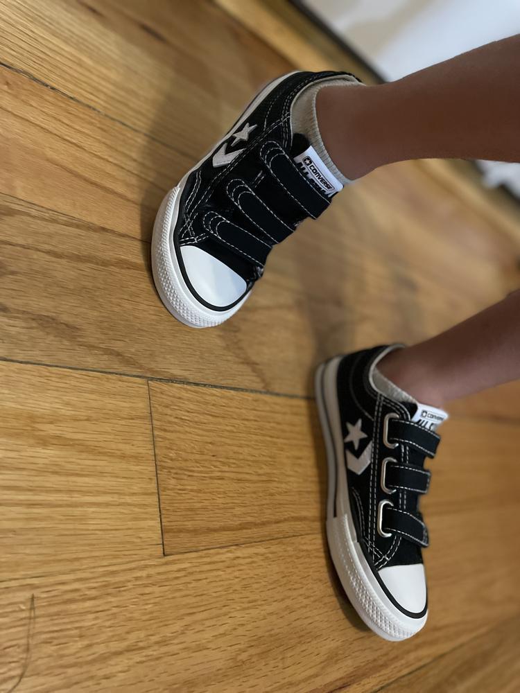 This sneaker fits true to size and is the ultimate classic sneaker! I got these for my son, and my daughter wants to steal them! They are so cute with the designs both on the outer and inner part of the shoe! They both love that they are Velcro so no fuss putting them on. We highly recommend this comfy, classic, stylish sneaker!