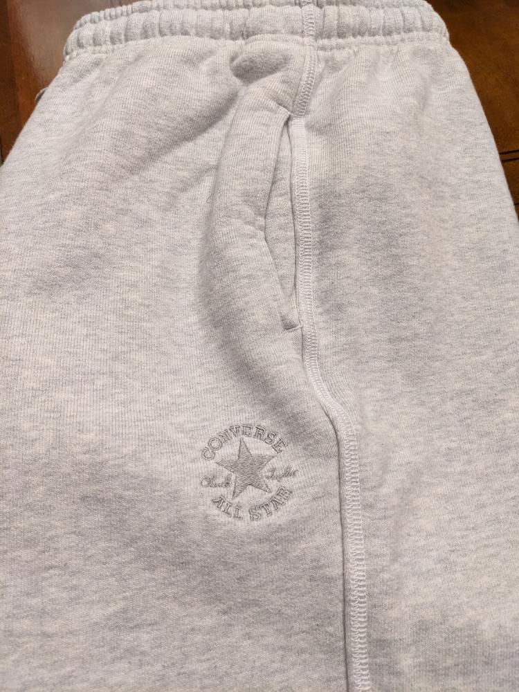 I'm extremely happy with these pants! The metal on the end of the strings and fancy stitching down the sides is high quality and adds character.  My phone fits great in the deep side pockets besides the back pocket being deep enough to zip in.  The material inside is not fleece, but more of a terry material.  These are gender neutral pants and as a 5'6" female the small fits me perfectly.  The crotch area is slightly lower than what I normally wear, but as lounge or athletic pants, it really doesn't matter and adds to the mobility and comfort.  These pants are heavy, so I'm excited to wear them on cool fall days outside.