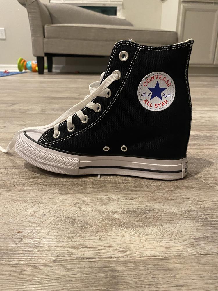 I really love these shoes. They have the classic look of the high top chuck taylors but have the lift from the wedge making them feel super stylish. The are leg elongating with a casual look which is super unique. They were surprisingly comfortable as well. I work as a nurse practitioner and wear them with scrubs for a 12 hour day and my feet never felt sore! I felt like that was a true test of comfort. My toes slipped a little just with the nature of wedge heel but it didn’t end up bothering me or causing blisters. They do run large I ended up going a half size smaller and that did well. I would definitely rec these shoes to someone wanting a heel lift with a sporty look for casual wear.