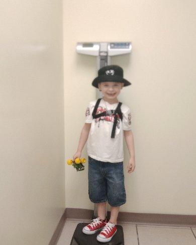 CUTEST KID IN HIS CUTE RED CHUCKS!