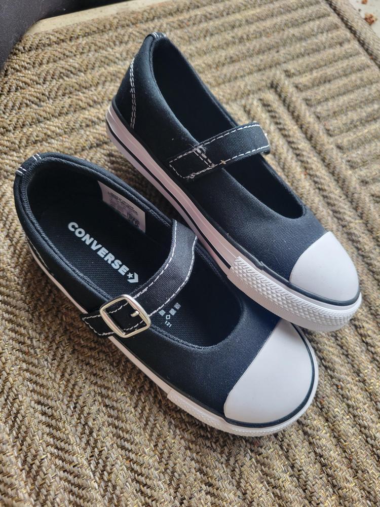 These cute Mary Janes go with everything! The black goes with everything and I think will hide wear and tear better. They are dainty and girly while still having the trademark Converse look. I think they'll go with everything from jeans and leggings to dresses and dress up costumes!

The Velcro feels strong and is long so you can get the right fit for any volume foot (see pictures). It makes the shoes easy for my kiddo to get on and off herself. The fabric is thick and feels strong. They're rigid enough that she'll need to wear them with socks until they're broken in more, maybe then (and once her feet grow some more) they'll be comfy enough to wear barefoot.

I wish the sole was a bit more flexible since it's for young feet, but it is pretty rigid similarly to adult converses. The toe box is larger and less pointed than adult converses though which is great for accommodating little kid feet!