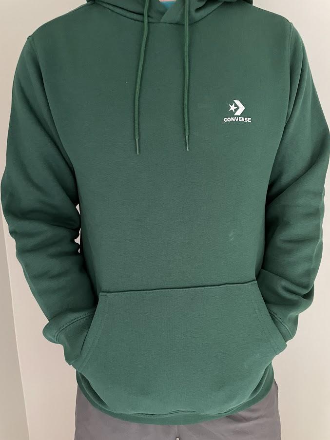This hoodie is exactly what I would expect from a quality hoodie. It does not feel cheap. The fabric feels thick high-quality. The hoodie fit true to size to medium, and I usually wear medium, but would not have been mad if it was slightly larger (generally it's nice for hoodies to fit larger). This hoodie does feel like it's in the spirit of "slim fit" around the torso, though fit comfortably on the arms and is overall comfortable to wear. The material feels like it will hold up after prolonged use and washing, though that remains to be seen. I really like the low-profile logo, probably my favorite feature: it's simple and the stitching complements the green well. I would definitely wear this while lounging or out with some friends. My wife loves the green color too and says it looks good on me (brown eyes/brown hair).