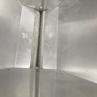 Increased the gap between the hopper flanges so grain could fall through
