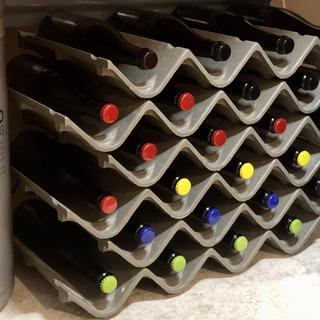 Two dozen beers cellaring! Color-coded caps!