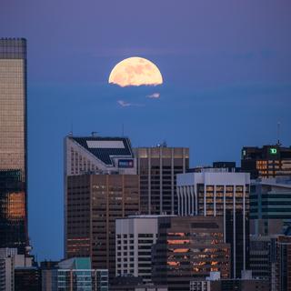 Calgary April Supermoon  
1/140 sec, f/5.6, iso400, 300 mm. 
Taken from 3.92 km away.